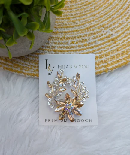 Golden floral crystal brooch for hijab styling with secure pin clasp