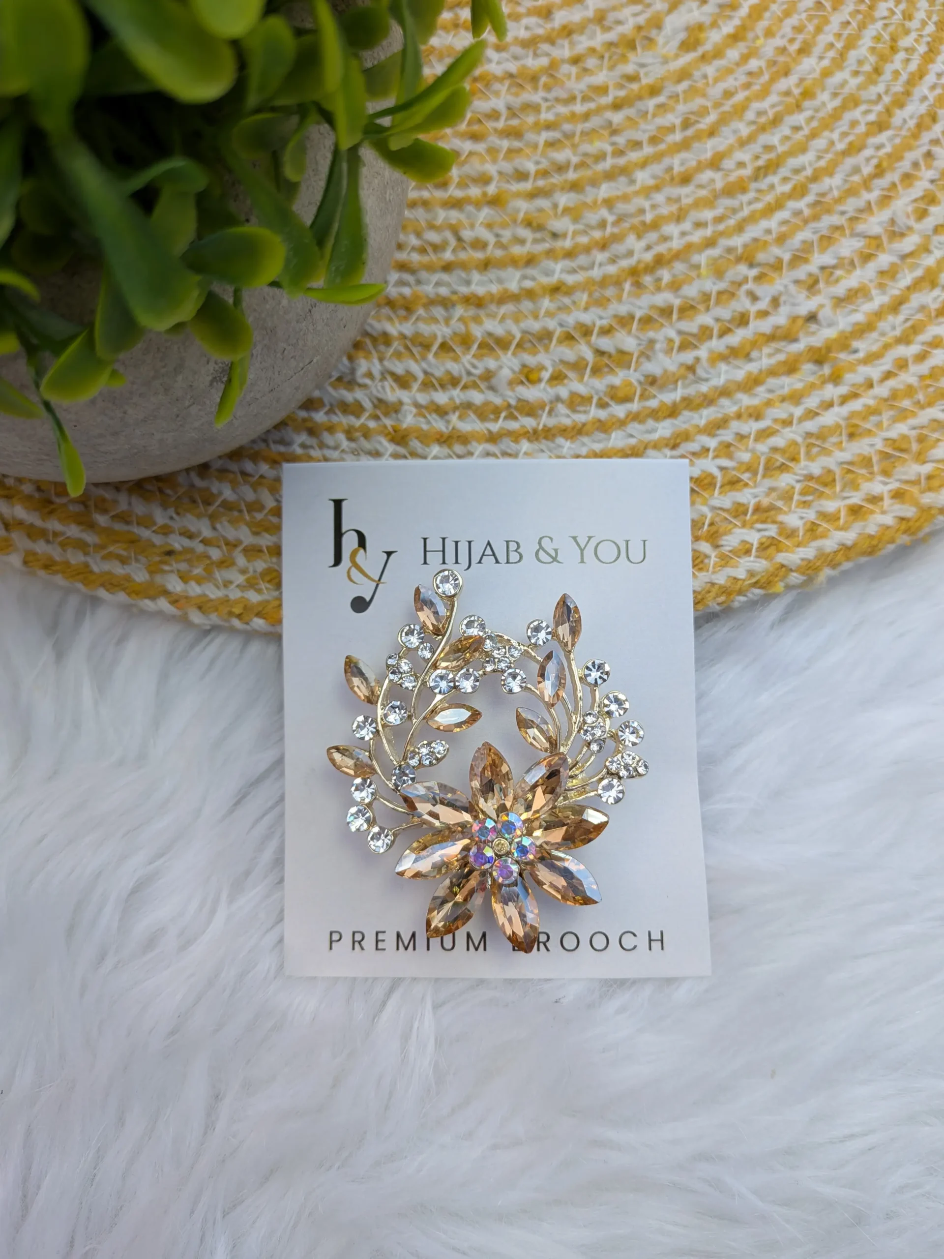 Golden Bloom Crystal Brooch for Hijab – Premium Floral Accessory Golden floral crystal brooch for hijab styling with secure pin clasp